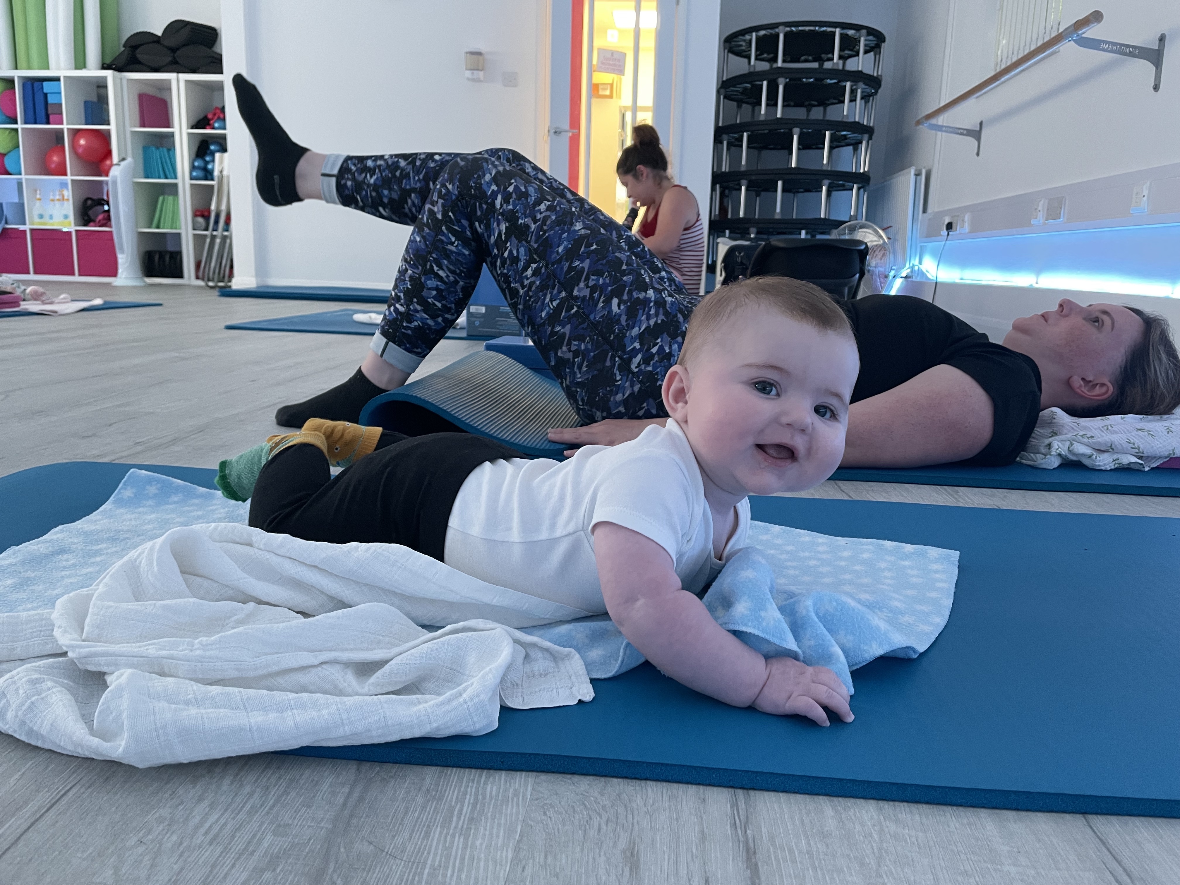 Mums exercising together in a postnatal Pilates class in North Hertfordshire