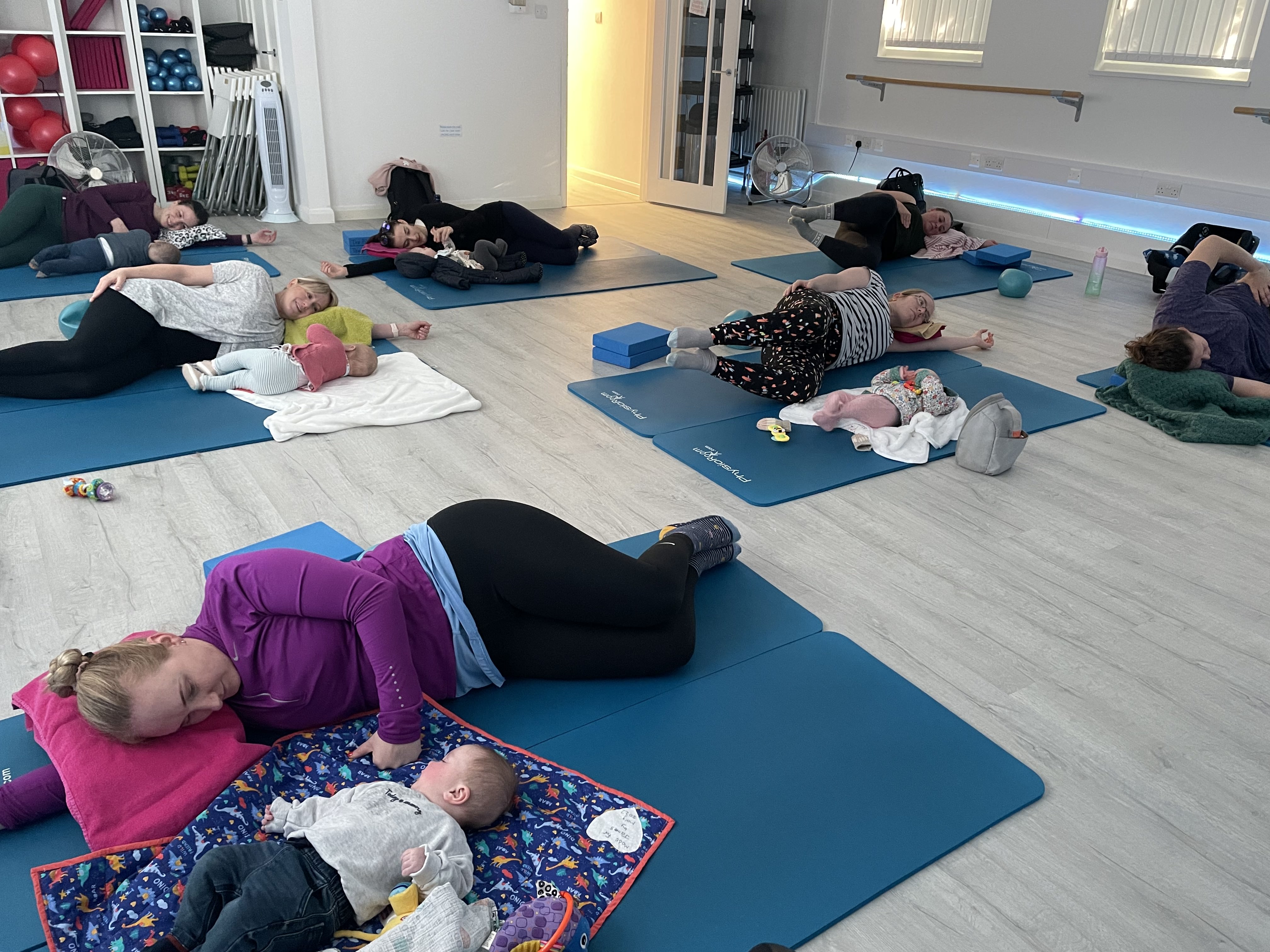 A gentle postnatal Pilates session with babies in the Baldock studio